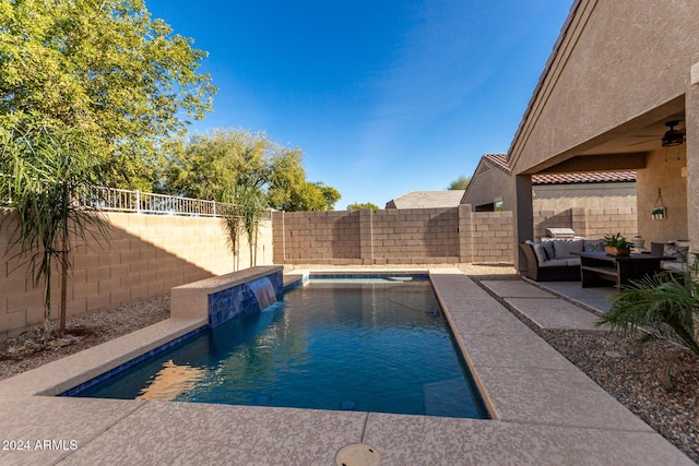 view of pool featuring pool water feature, an outdoor living space, and a patio area