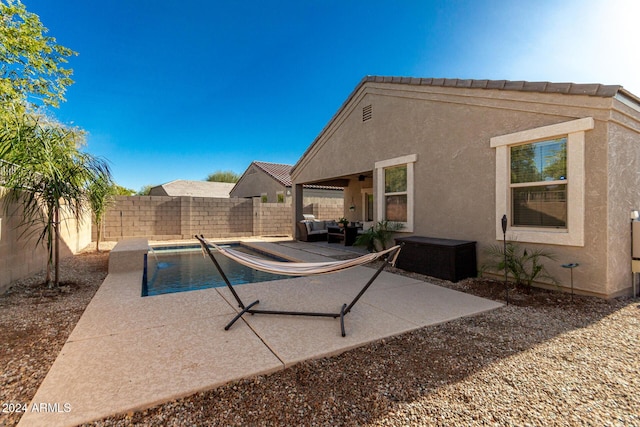 view of swimming pool with outdoor lounge area and a patio