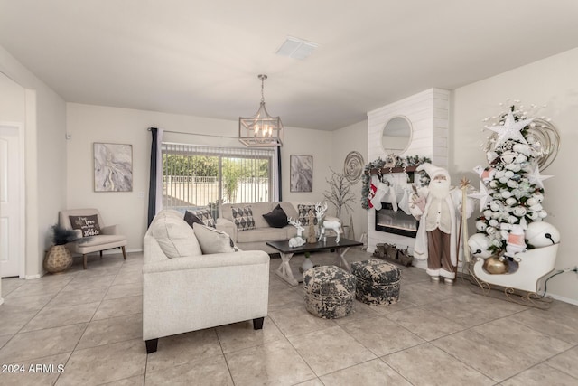 tiled living room with an inviting chandelier