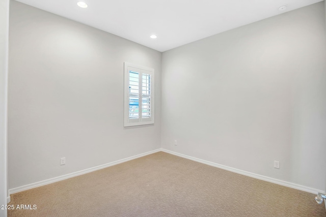 unfurnished room with baseboards, recessed lighting, and light colored carpet