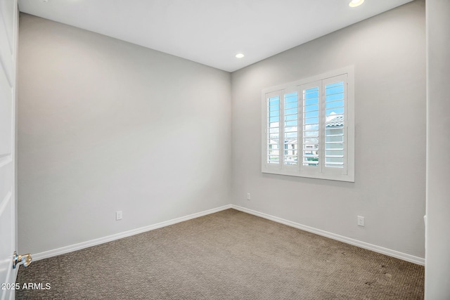 carpeted empty room featuring recessed lighting and baseboards