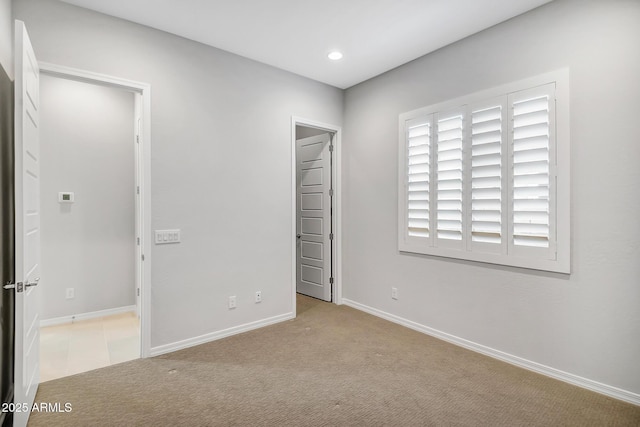 unfurnished bedroom featuring baseboards, carpet flooring, and recessed lighting