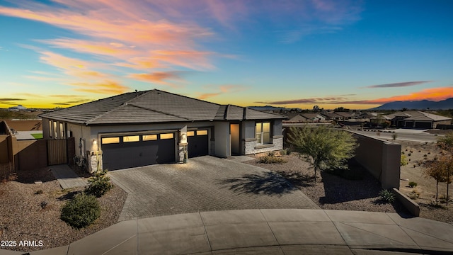 prairie-style home featuring a garage