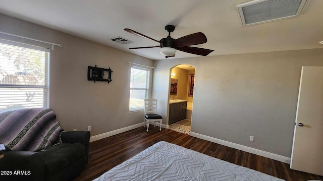 interior space featuring a wealth of natural light, dark hardwood / wood-style flooring, and ceiling fan