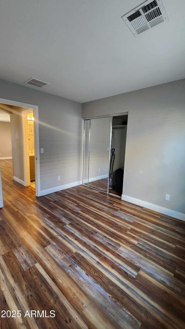 empty room featuring dark hardwood / wood-style floors