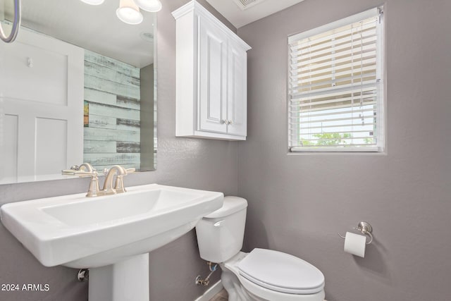 bathroom featuring toilet and sink