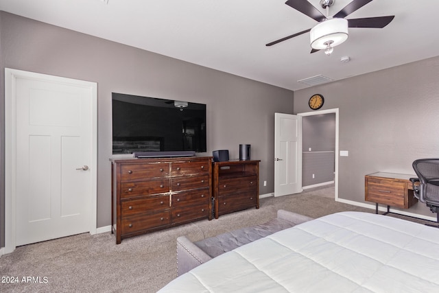 bedroom featuring ceiling fan and light carpet