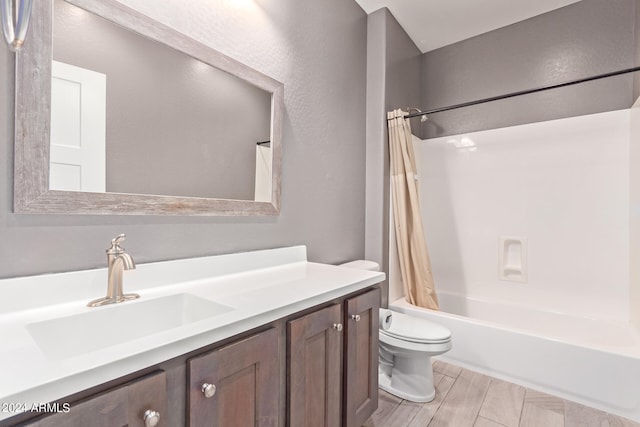 full bathroom featuring vanity, toilet, and shower / tub combo with curtain