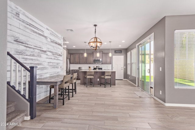 dining room featuring an inviting chandelier and light hardwood / wood-style floors