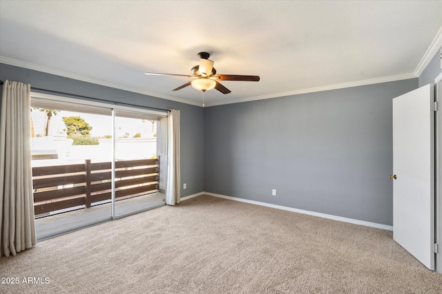 carpeted empty room featuring ceiling fan and ornamental molding