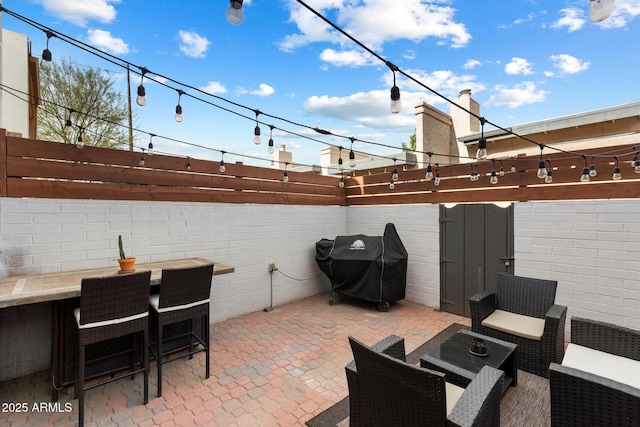 view of patio featuring a grill