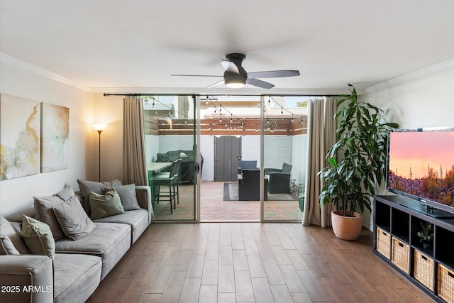 living room featuring ceiling fan and ornamental molding