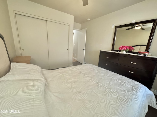 bedroom with a ceiling fan and a closet