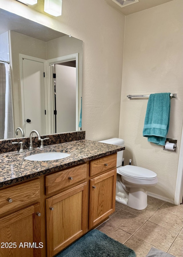 full bath with toilet, tile patterned flooring, visible vents, and vanity