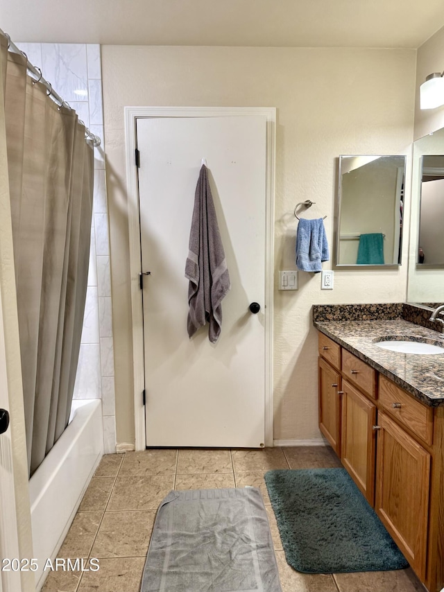 full bathroom featuring shower / bath combo with shower curtain, vanity, and tile patterned floors