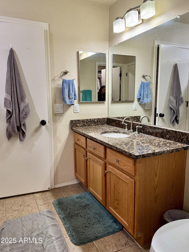 bathroom with tile patterned flooring and vanity