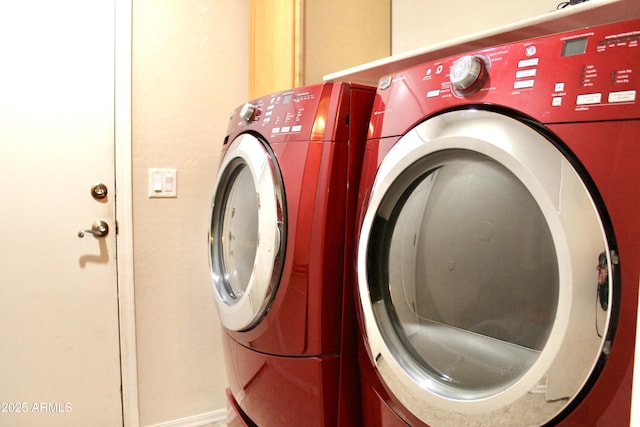 clothes washing area featuring laundry area and separate washer and dryer