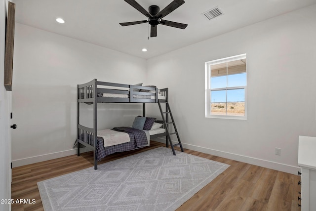 bedroom featuring light wood finished floors, recessed lighting, visible vents, and baseboards