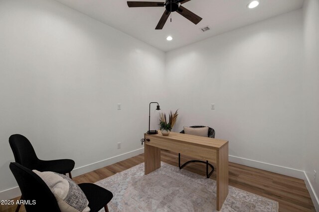 office featuring light wood-style floors, recessed lighting, visible vents, and baseboards