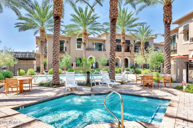 view of swimming pool featuring a patio