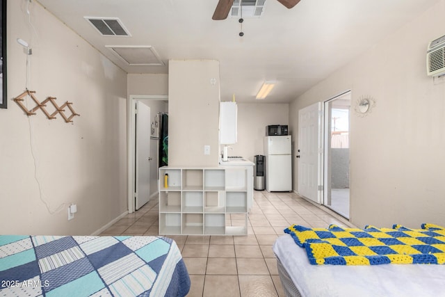 4403 N 56th Dr, Phoenix, AZ 85031 - bedroom featuring freestanding refrigerator, light tile patterned floors, attic access, and a ceiling fan