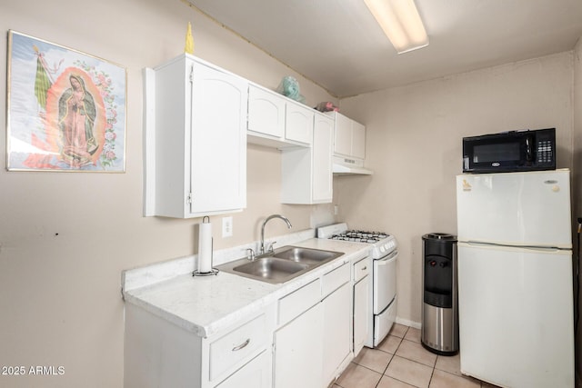 4403 N 56th Dr, Phoenix, AZ 85031 - kitchen featuring white appliances, a sink, white cabinetry, light countertops, and light tile patterned floors