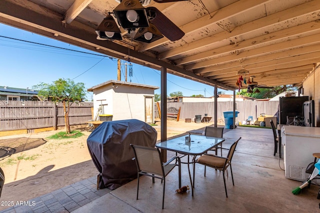 4403 N 56th Dr, Phoenix, AZ 85031 - fenced backyard featuring ceiling fan, outdoor dining area, and a patio
