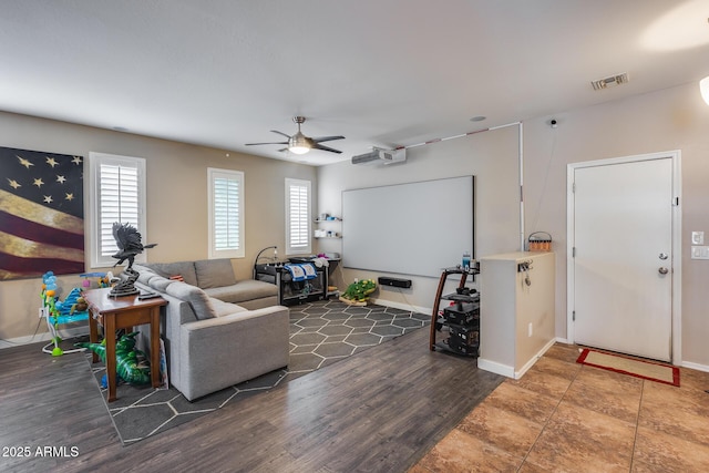 living room with ceiling fan and wood-type flooring