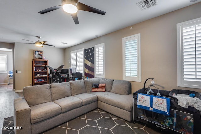 living room featuring dark hardwood / wood-style floors and ceiling fan