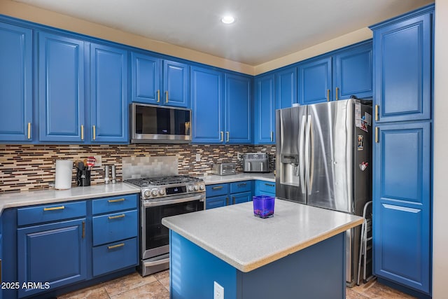 kitchen featuring blue cabinetry, decorative backsplash, a center island, and stainless steel appliances