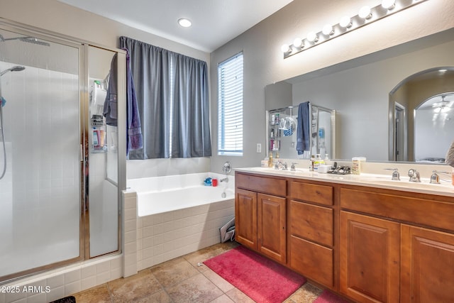 bathroom featuring vanity and separate shower and tub