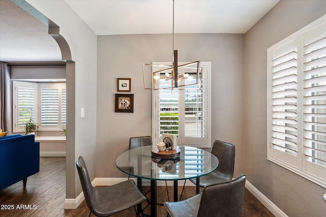 69 W Virginia Ave, Phoenix, AZ 85003 - dining room with wood finished floors, baseboards, and plenty of natural light