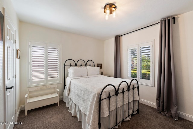 69 W Virginia Ave, Phoenix, AZ 85003 - bedroom with dark carpet and baseboards