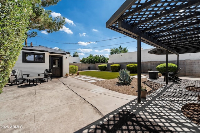 69 W Virginia Ave, Phoenix, AZ 85003 - fenced backyard featuring a pergola, a patio area, and an outdoor structure