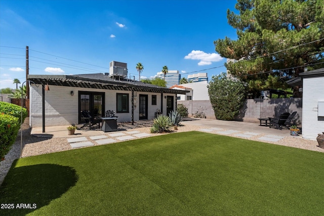 69 W Virginia Ave, Phoenix, AZ 85003 - rear view of house featuring a patio area and central air condition unit