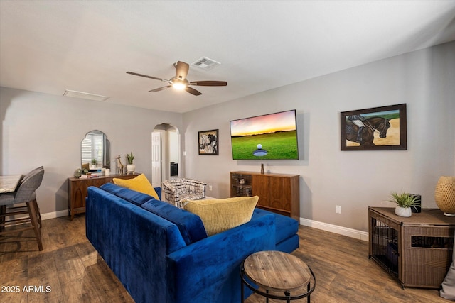69 W Virginia Ave, Phoenix, AZ 85003 - living room featuring arched walkways, wood finished floors, baseboards, and ceiling fan