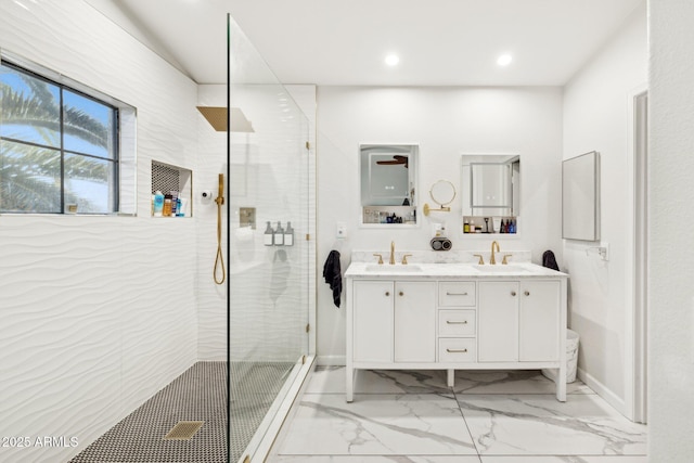 bathroom featuring vanity and a shower with shower door