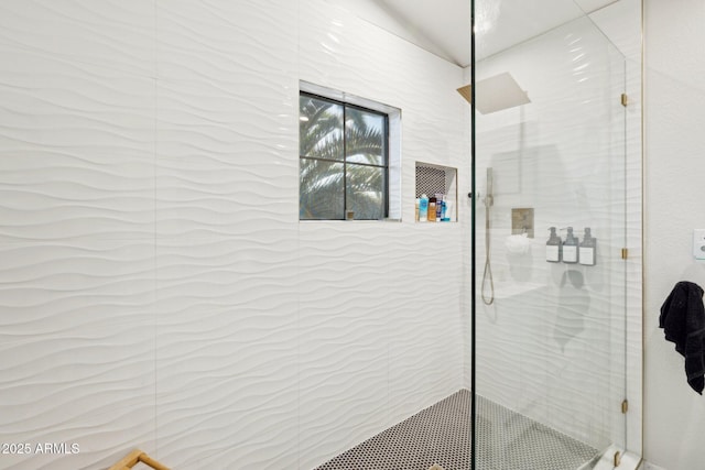 bathroom with a tile shower