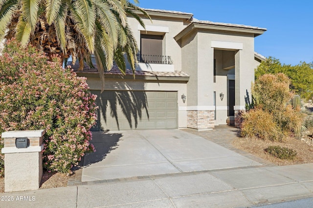 view of front of house with a garage and a balcony