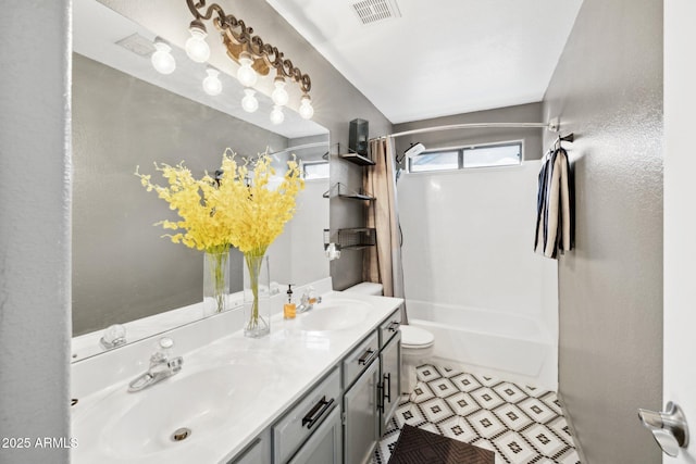 full bathroom featuring toilet, vanity, and bathtub / shower combination