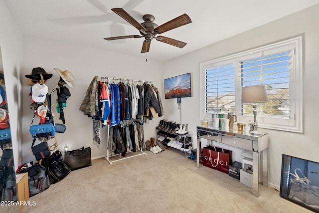 misc room with ceiling fan and light carpet