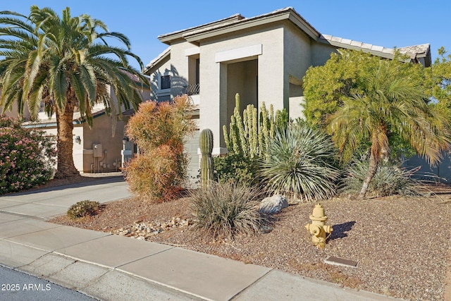 view of side of property featuring a balcony