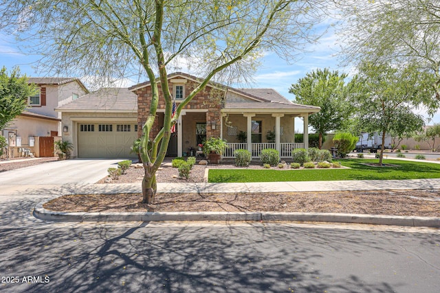 20421 W Legend Trl, Buckeye, AZ 85396 - view of front of house with covered porch, a garage, concrete driveway, and stucco siding