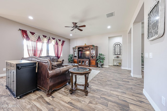 20421 W Legend Trl, Buckeye, AZ 85396 - living room with ceiling fan, light wood-style flooring, recessed lighting, and baseboards