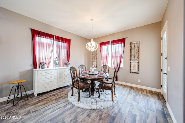 20421 W Legend Trl, Buckeye, AZ 85396 - dining area with a chandelier, wood finished floors, and baseboards
