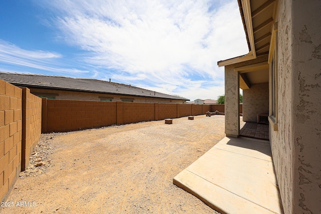 20421 W Legend Trl, Buckeye, AZ 85396 - fenced backyard featuring a patio area