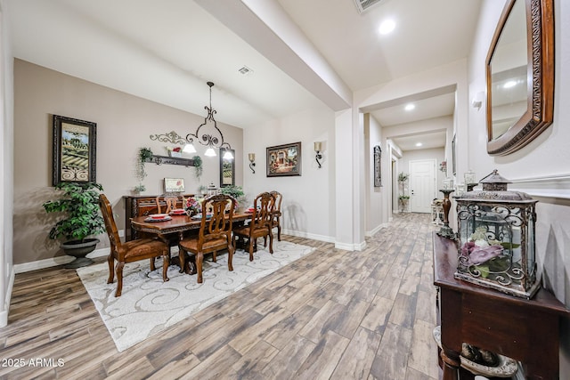 20421 W Legend Trl, Buckeye, AZ 85396 - dining space featuring wood finished floors, baseboards, and recessed lighting