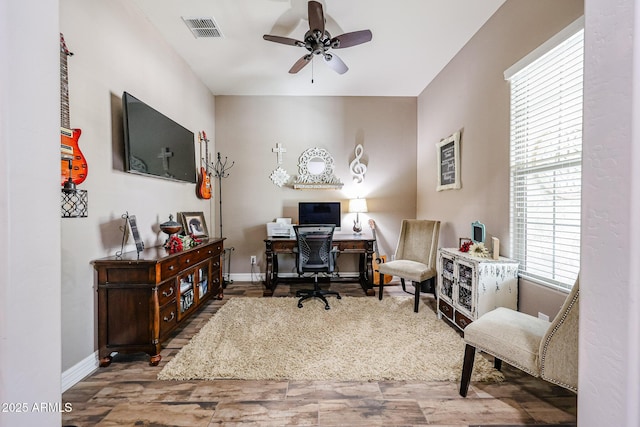 20421 W Legend Trl, Buckeye, AZ 85396 - home office with a ceiling fan, wood finished floors, and baseboards