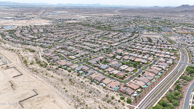 20421 W Legend Trl, Buckeye, AZ 85396 - aerial overview of property's location featuring a mountainous background and nearby suburban area