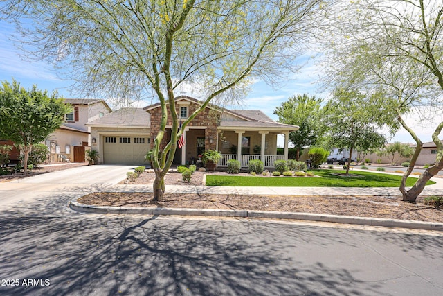 20421 W Legend Trl, Buckeye, AZ 85396 - view of front of home with covered porch, an attached garage, stucco siding, concrete driveway, and stone siding